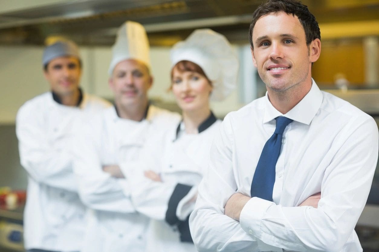 A group of chefs standing in front of each other.