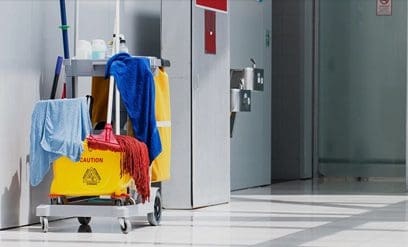 A cleaning cart with a bunch of items on it